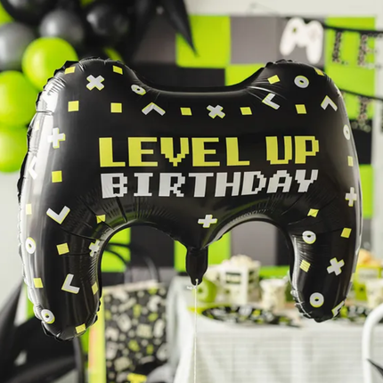 Folieballon met de tekst level up birthday in de vorm van een controller